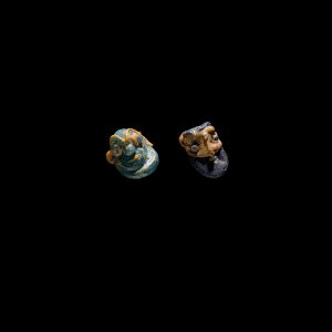 * LOT DE DEUX PENDENTIFS ANTHROPOMORPHES